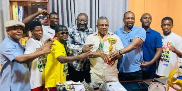 Black Rockets paid a courtesy call to the CEO of Baseline Pharmacy with their medals 