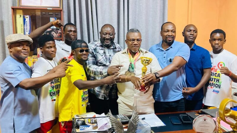 Black Rockets paid a courtesy call to the CEO of Baseline Pharmacy with their medals 