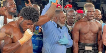 Boxing fans sit in rain to watch as Baubali bows to the beast, Dickson